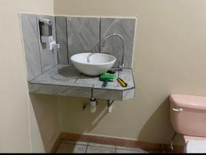 a bathroom with a sink and a toilet at Hotel El Paraiso Escondido - Costa Rica in Jacó +55 photos