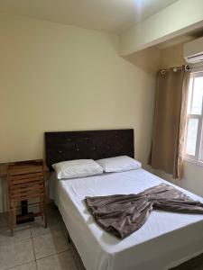 Ένα ή περισσότερα κρεβάτια σε δωμάτιο στο Vila das Dunas - Santinho