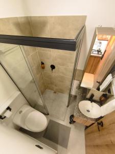 a bathroom with a shower and a white sink at Mi Fortaleza Cali, Valle del Cauca Santa Isabel Cerca a IMBANACO in Cali