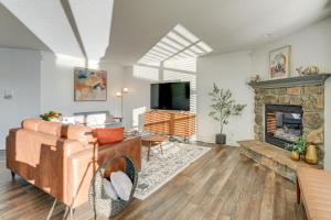 a living room with a couch and a fireplace at Private Yard and Pond Views Fort Wayne Family Home! in Arcola