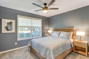 a bedroom with a bed and a ceiling fan at Private Yard and Pond Views Fort Wayne Family Home! in Arcola