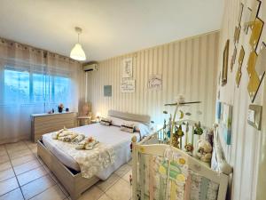 a bedroom with a bed with teddy bears on it at Casa Esemes in Giarre