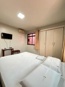 Postel nebo postele na pokoji v ubytování Hotel Visconde