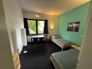 Postel nebo postele na pokoji v ubytování Hotel Grünewald chs