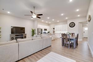 a living room with a couch and a dining room at Pet-Friendly Ozark Home with Yard and Patio in Ozark