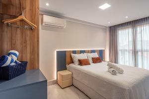 a bedroom with a bed and a air conditioner at Prédio em Barra Grande - Maragogi in Maragogi +66 photos