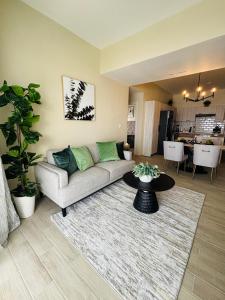 a living room with a couch and a table at Apartment Luxury ONA Residence, Punta Cana in Punta Cana