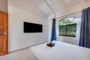 Μια τηλεόραση ή/και κέντρο ψυχαγωγίας στο Villaggio 1 Apartments