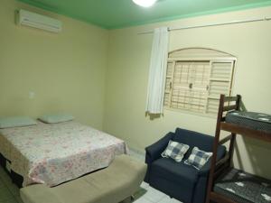 Ένα ή περισσότερα κρεβάτια σε δωμάτιο στο Recanto Rio do Peixe - Lindóia-sp