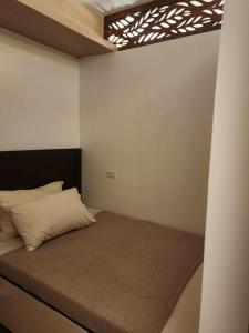 Postel nebo postele na pokoji v ubytování 1-bedroom Modern Tropical Condo in Ortigas, Pasig