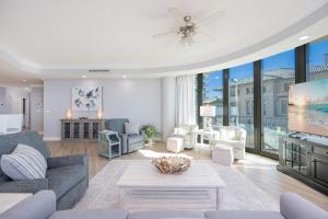 a living room with a couch and a table at Phoenix on the Bay 1134 condo in Caswell