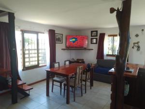 a living room with a table and a couch at CASA Barrio Parque Mar in Miramar