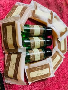 a group of four bottles of wine on a pink blanket at Hotel Churu Palace in Jaipur