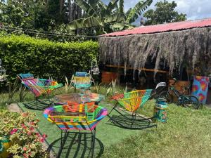a group of chairs and a table in a yard at Cabañas Villa del Prado in Gigante +21 photos
