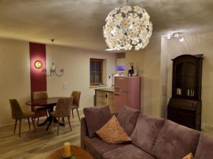 a living room with a couch and a table at Allgäunest in Oberstdorf