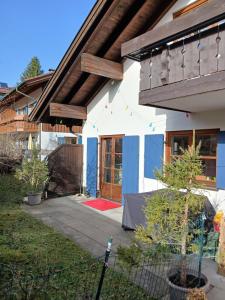 a house with a fence in front of it at Allgäunest in Oberstdorf