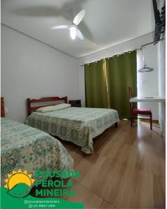 Postel nebo postele na pokoji v ubytování Pousada Pérola Mineira