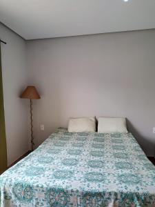 Postel nebo postele na pokoji v ubytování Pousada Pérola Mineira