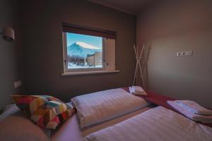 Postel nebo postele na pokoji v ubytování Hotel Hafnarfjall