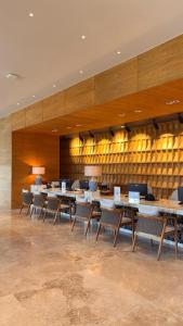 a dining room with tables and chairs in a building at Hotel Mundo Maya Palenque in Palenque +80 photos