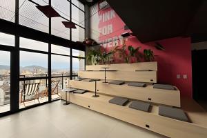 a room with some plants on a wall with windows at Art. in Santa Maria