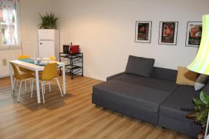 a living room with a couch and a table at Delicious next to Florence in Scandicci +15 photos