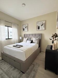 a bedroom with a large bed and a window at Apartment Luxury ONA Residence, Punta Cana in Punta Cana