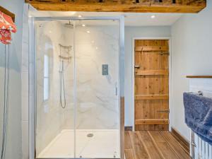 a shower with a glass door in a bathroom at 4 Bed in Sedbergh SZ595 in Milnthorpe +16 photos