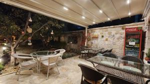 a patio with tables and chairs in a restaurant at Yıldız Hotel in Urgup