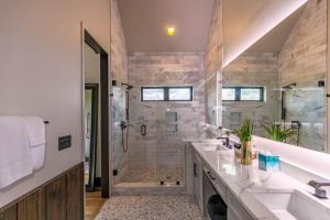 a bathroom with two sinks and a shower at Bucks and Bunnies at Eagles Nest in Elk Park +74 photos