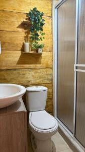 a bathroom with a toilet and a sink at El Almendrón Beach Hostel in Santa Marta +31 photos