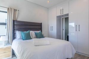 Ένα ή περισσότερα κρεβάτια σε δωμάτιο στο Greystone Serenity 2-Bedroom Apartment