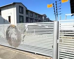 a white fence in front of a building at Peaceful stay in Richards Bay +47 photos