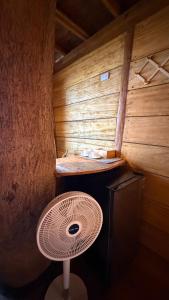 a room with a fan in a sauna at El Almendrón Beach Hostel in Santa Marta