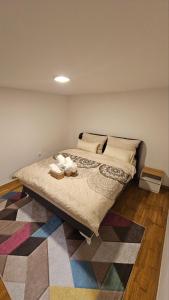 a bedroom with a large bed with a colorful rug at Sunny Garden Old Town in Sarajevo