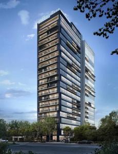 un edificio alto con muchas ventanas en STÚDIO - Novo e Sofisticado!, en Princesa dʼOeste