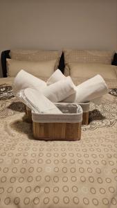 a pile of towels sitting on top of a room at Sunny Garden Old Town in Sarajevo