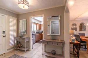 a kitchen with a table and a mirror and a desk at Lakeside Living at Hound Ears in Valle Crucis +43 photos