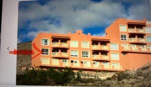 an orange building on top of a hill at Casa Sofia in Costa Calma