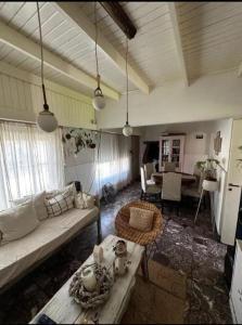 a living room with a couch and a table at Chalet House in La Plata 