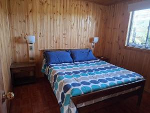 Ένα ή περισσότερα κρεβάτια σε δωμάτιο στο Cáhuil Cabañas Central