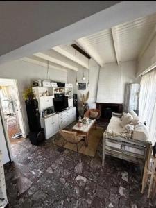 a living room with a couch and a table at Chalet House in La Plata 