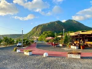 a street with a mountain in the background at Casa Uta in Tarrafal
