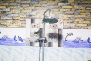 a shower with penguins swimming in the water at Secret View Homestay Ella in Ella +57 photos