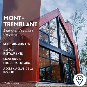 ein Schild vor einem Gebäude mit Fenstern in der Unterkunft Bright chalet with hot tub and indoor sauna in Lac-Superieur