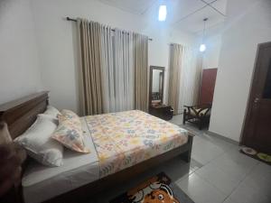 Ένα ή περισσότερα κρεβάτια σε δωμάτιο στο Serenique Greens