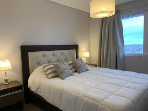 En eller flere senge i et værelse på Rent a Flat