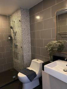 a bathroom with a toilet and a sink and a shower at The Terraza A212 - Cozy Apartment By Sp Villa in Amphoe Koh Samui