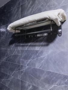 a towel is sitting on top of a wall at Aurum Pyramids in Cairo