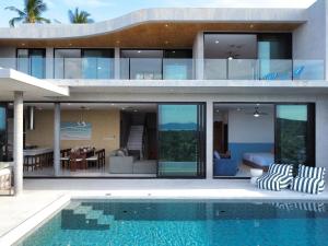 a house with a swimming pool in front of it at Villa La Lay By S&p Villa Management in Ban Tai +82 photos